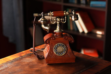 Old vintage retro telephone station. Great interior object. Old fashioned telephone. Vintage red phone.