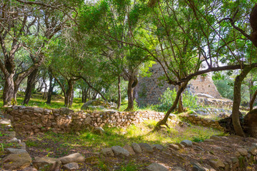 Scenic landscape of green hills and rocky mountains of the island of Sardinia in spring