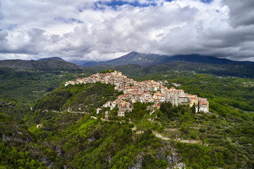 Fototapeta na wymiar Panoramic view at green hills with old town of Rivello in Italy