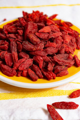Healthy superfood, red dried goji chinese wolfberry berries, used in many snack foods and supplements, granola bars, yogurt, tea blends, fruit juice as whole berries or ground seeds, seed oil.