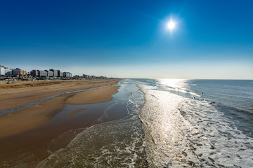 Sunny day on North sea beach in Netherlands near Schegeningen