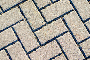 Pavement texture. Gray brick paving stones on a sidewalk