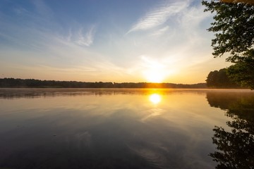 Obraz na płótnie Canvas View on a lake during sunrise