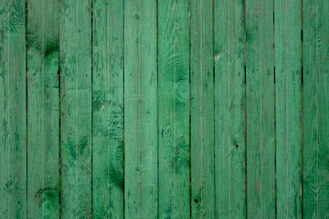 Vintage green wood panel fine arranged as wall for interior design and exterior decoration.Background, vertical.