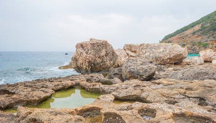 Beaches of the island of Sardinia in the Mediterranean Sea in sunlight in spring