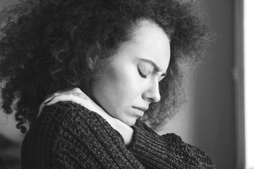 Portrait of young brunette woman, annoyed and frustrated. Mental disorders bulimia, addiction. Sadness, nostlagic, depression. Mental problems of young people. Black and white photo.