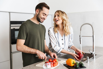 Loving couple cooking at the kitchen at home have a breakfast.