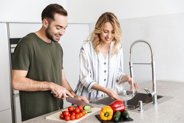 Loving couple cooking at the kitchen at home have a breakfast.