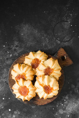 Obraz na płótnie Canvas Cookies with apricot jam on a dark background
