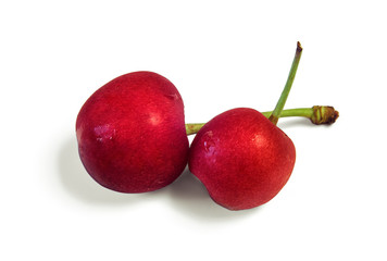 Fresh sweet cherry from the fridge with condensate droplets. Chilled fruits. Red berry. Isolated on white background.
