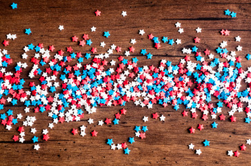 American Independence day background with blue, white and red mixed stars. Celebration of American independence day, the 4th of July (the Fourth of July). Holiday concept. Top view. With copy space. 