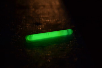 green bottle on black background