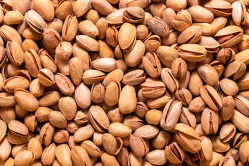 Roasted pistachio nuts. Background for wallpaper in the form of a pattern.