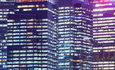 Fototapeta na wymiar background of skyscrapers windows at night