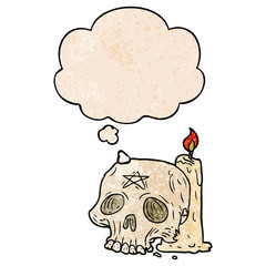cartoon spooky skull and candle and thought bubble in grunge texture pattern style