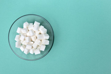 Sugar cubes in glass bowl, top down view © fortyforks