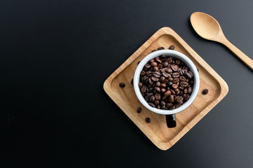 coffee bean in cup on black background