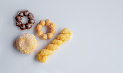 closeup donut on white table with soft-focus in the background. over light 01