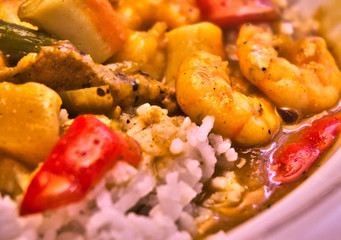 Curry rice in Japanese style with vegetables, shrimps and chilies, lunch