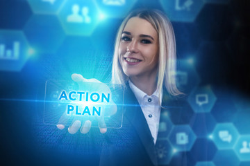 The concept of business, technology, the Internet and the network. A young entrepreneur working on a virtual screen of the future and sees the inscription: Action plan