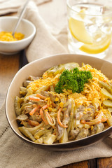 Salad of fried chicken hearts with vegetables, yolk and mayonnaise.