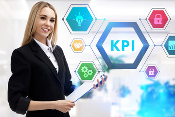 The concept of business, technology, the Internet and the network. A young entrepreneur working on a virtual screen of the future and sees the inscription: KPI