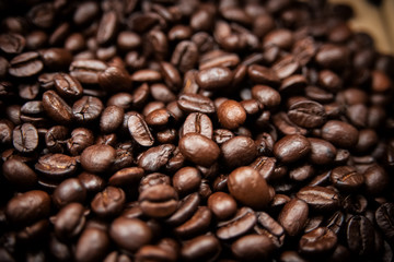 The abstract art design background of coffee beans background,blurry light around,vintage and art tone