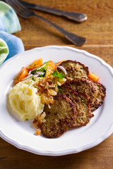 Beef liver pancakes with mashed potato and vegetables. Liver side dish