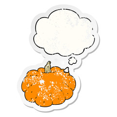 cartoon pumpkin and thought bubble as a distressed worn sticker