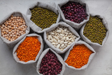 beans, lentils, peas, soybeans in bags on a white background close-up. Keto diet. Natural foo