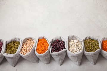 beans, lentils, peas, soybeans in bags on a white background. Keto diet.