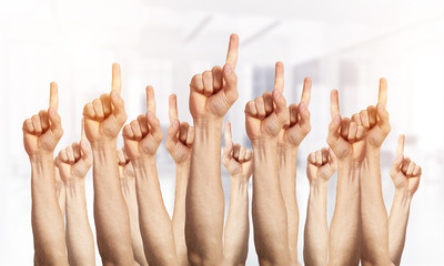 Row of man hands showing finger pointing gesture