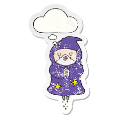 cartoon floating wizard and thought bubble as a distressed worn sticker