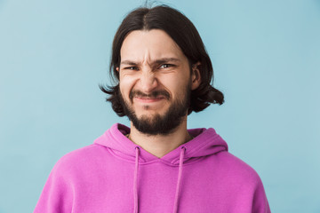 Portrait of a young bearded brunette man