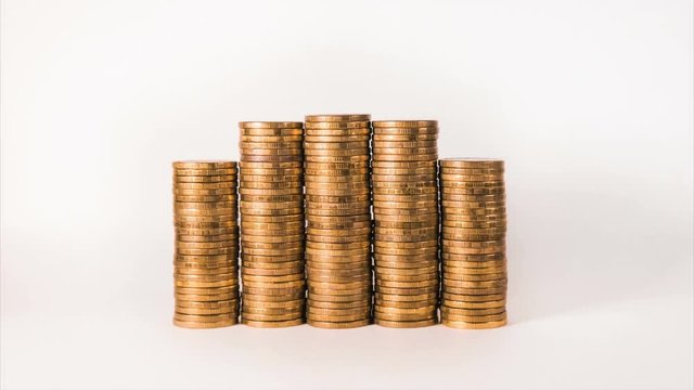 isolated motion graph with gold coins on white background