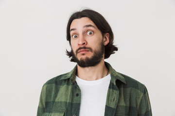 Portrait of a young bearded brunette man