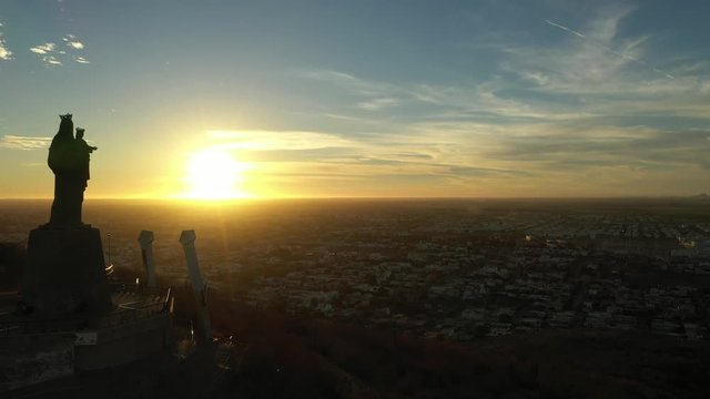 Aerial Drone Sunset View over Cerro de la Memoria and the Virgin in Los Mochis, Sinaloa, Mexico