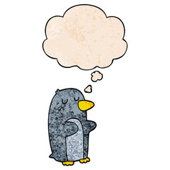 cartoon penguin and thought bubble in grunge texture pattern style