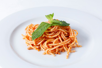 Spaghetti bolognese on white plate