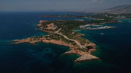 Aerial drone photo of famous luxurious Lemos peninsula in Vouliagemeni area with iconic celebrity...