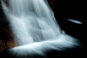 Fototapeta na wymiar Beautiful waterfall and big rocks