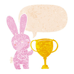 cute cartoon rabbit with sports trophy cup and speech bubble in retro textured style