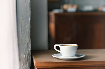 Fototapeta na wymiar Coffee morning with black coffee on wooden desk.