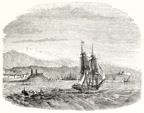 Ancient sailboat crossing the French sea with Antibe city and mountains on background. Ancient grayscale etching with fading borders. By Montigneul publ. on Magasin Pittoresque Paris 1848