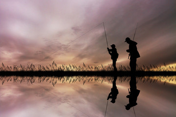 child fishing with his dad