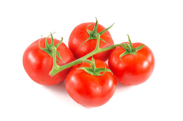 Fresh tomatoes with green leaves isolated on white background.