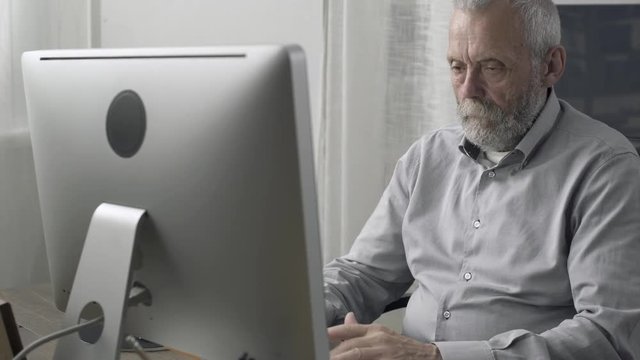 Senior man having an heart attack at home