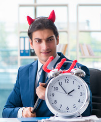 Devil angry businessman in the office