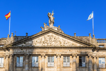 Fototapeta na wymiar Santiago de Compostela, Spain. The gable of the facade of the palace of Raxoi, 1772