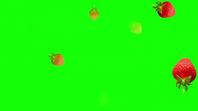 Strawberries flying on green background. Health concept